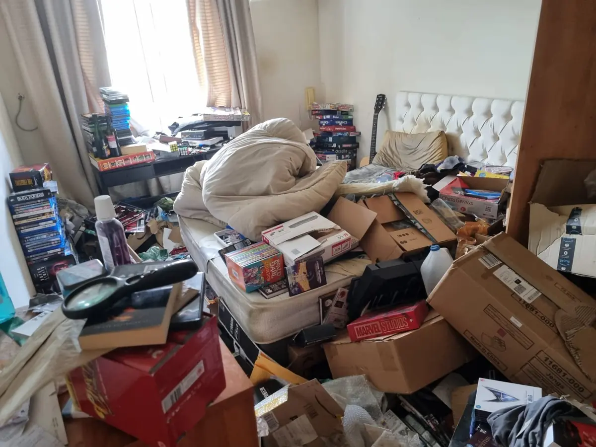 Boxes and bags brought down from an attic, ready for removal