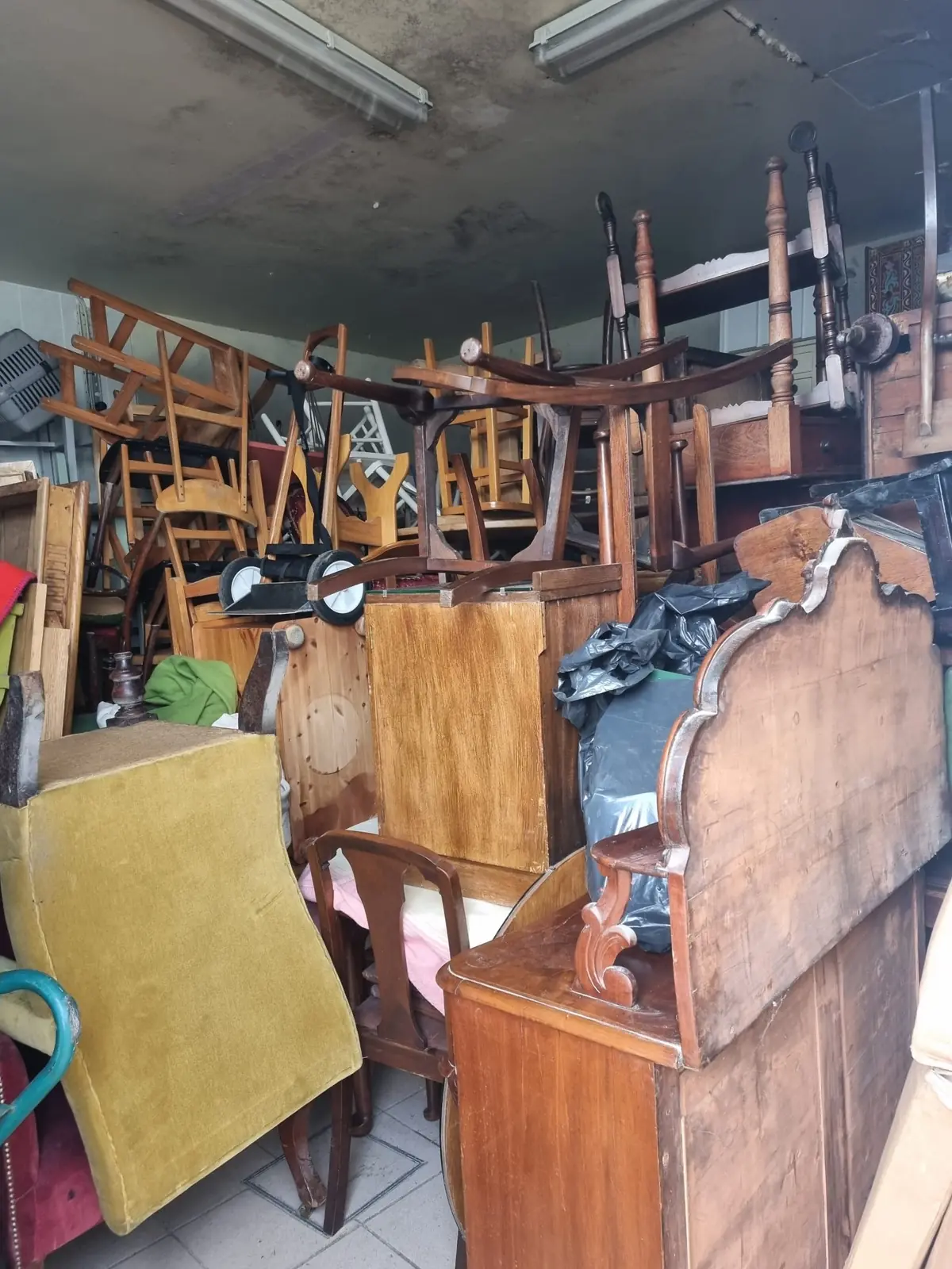 Stacked furniture and chairs ready for an office clearance