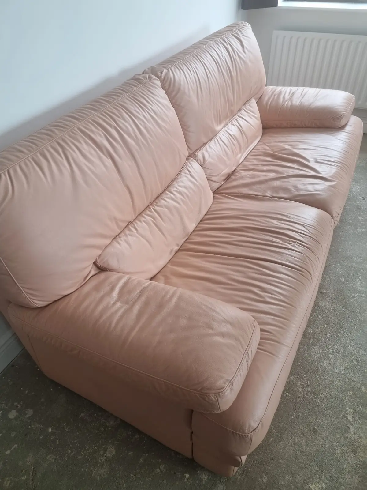 Old leather sofa waiting for furniture removal